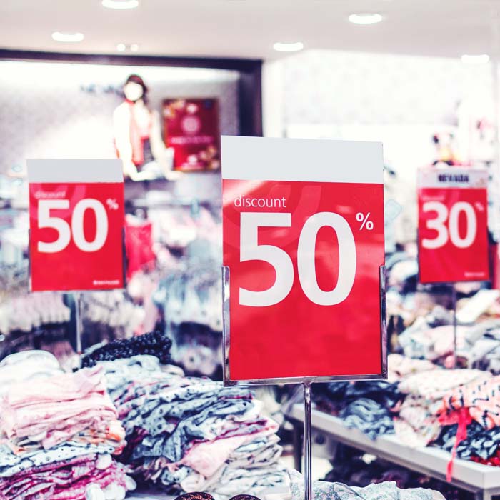 50% sale signs at a clothing store