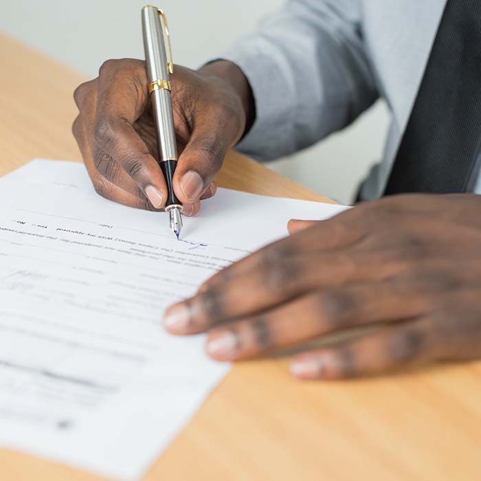 Man signing a legal document