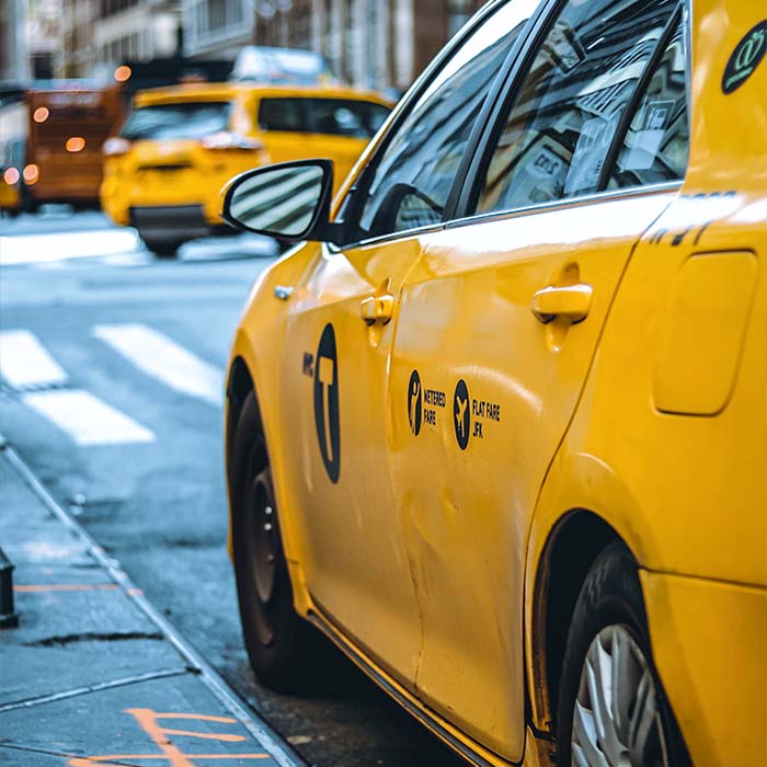 Side view of a yellow taxi cab