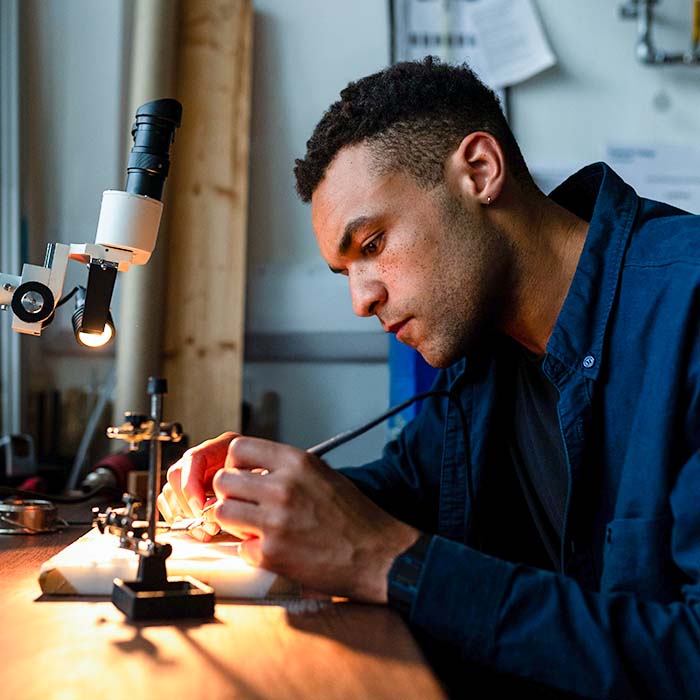 an engineer working on a circuit board